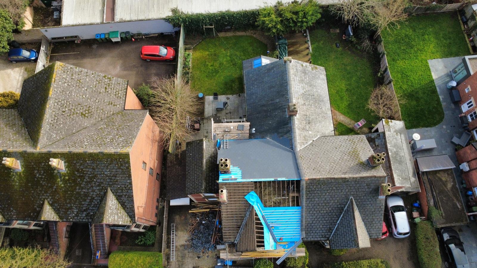 Roofing contractor working on property